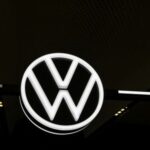 A Volkswagen logo is seen, on the day of the annual Volkswagen Group press conference in Wolfsburg, Germany March 11, 2025. REUTERS/Liesa Johannssen/File Photo
