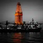 Offshore drilling platform at sea during twilight.