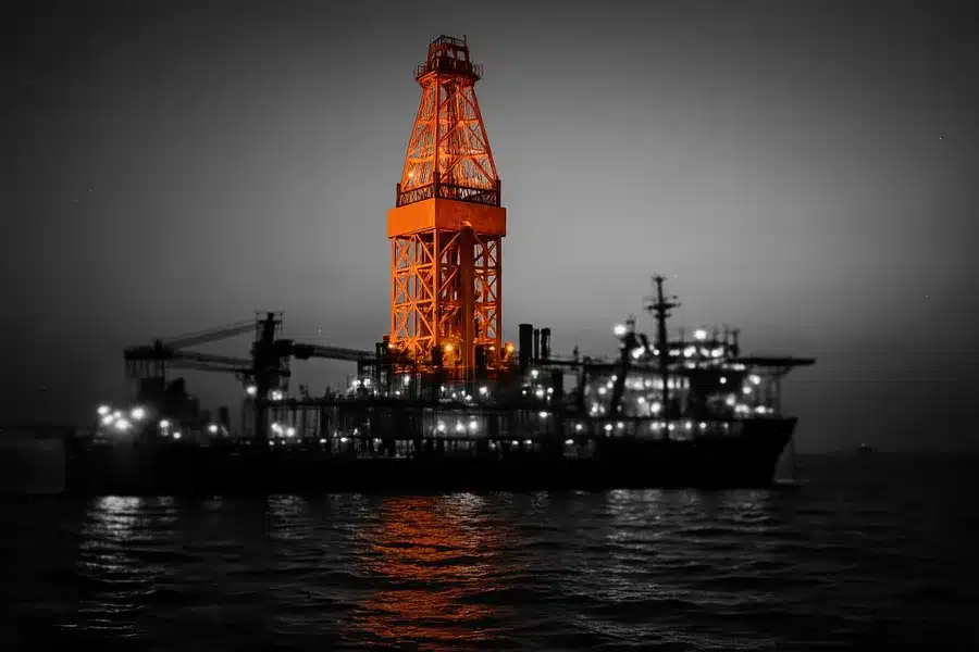 Offshore drilling platform at sea during twilight.