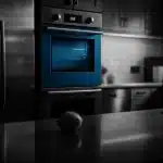 Modern kitchen appliances, including an oven and refrigerator.