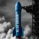 Rocket on a launch pad with smoke from engines visible.