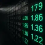 Stock market digital display board showing stock numbers.