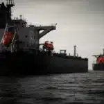 Two large oil tankers in the ocean.