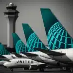 United Airlines planes and control tower at an airport.