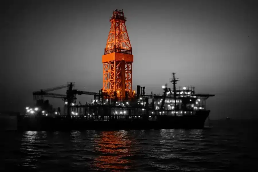Offshore drilling platform at sea during twilight.